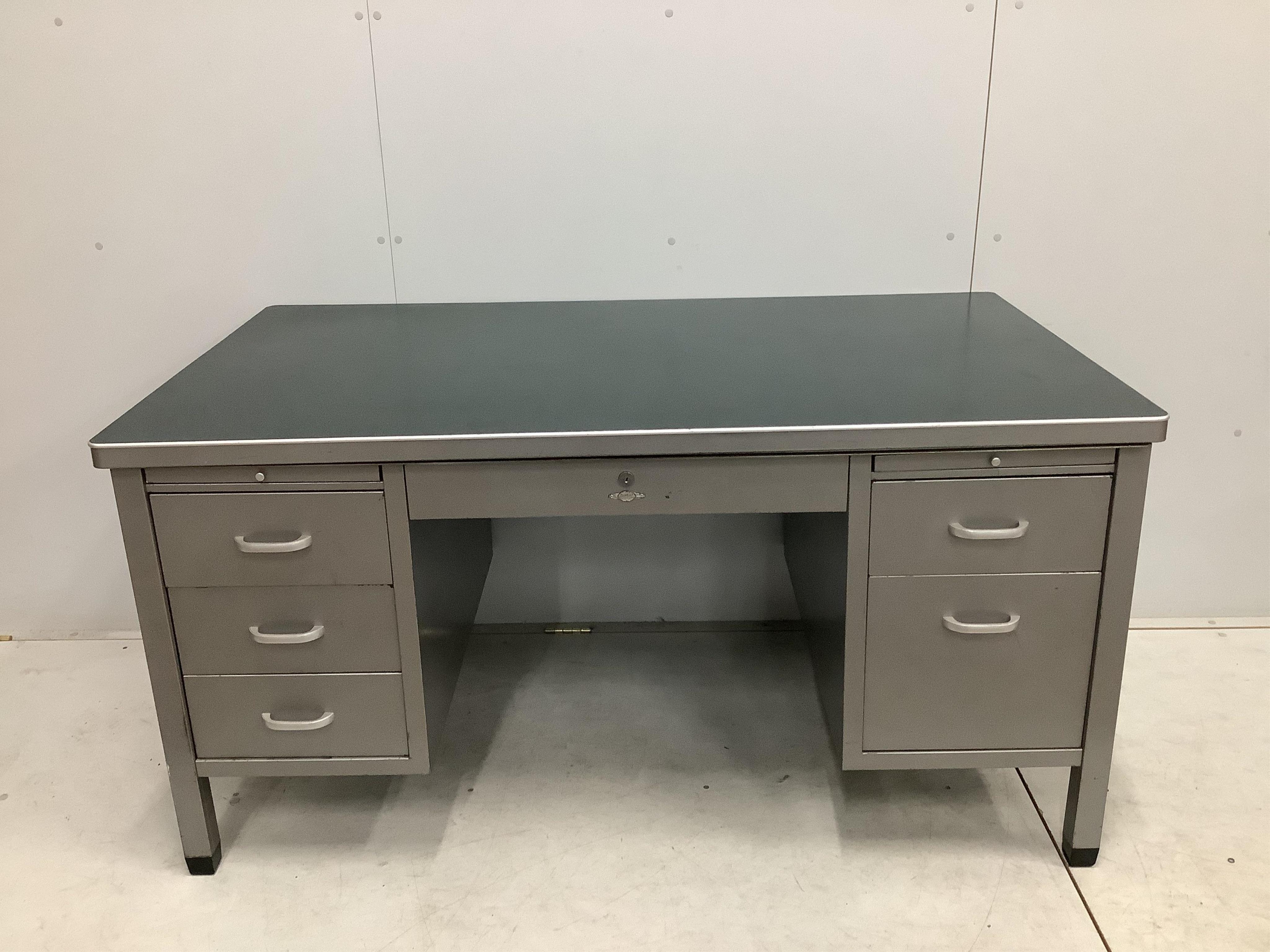 A mid century Art Metal steel kneehole desk, width 152cm, depth 86cm, height 78cm. Condition - fair